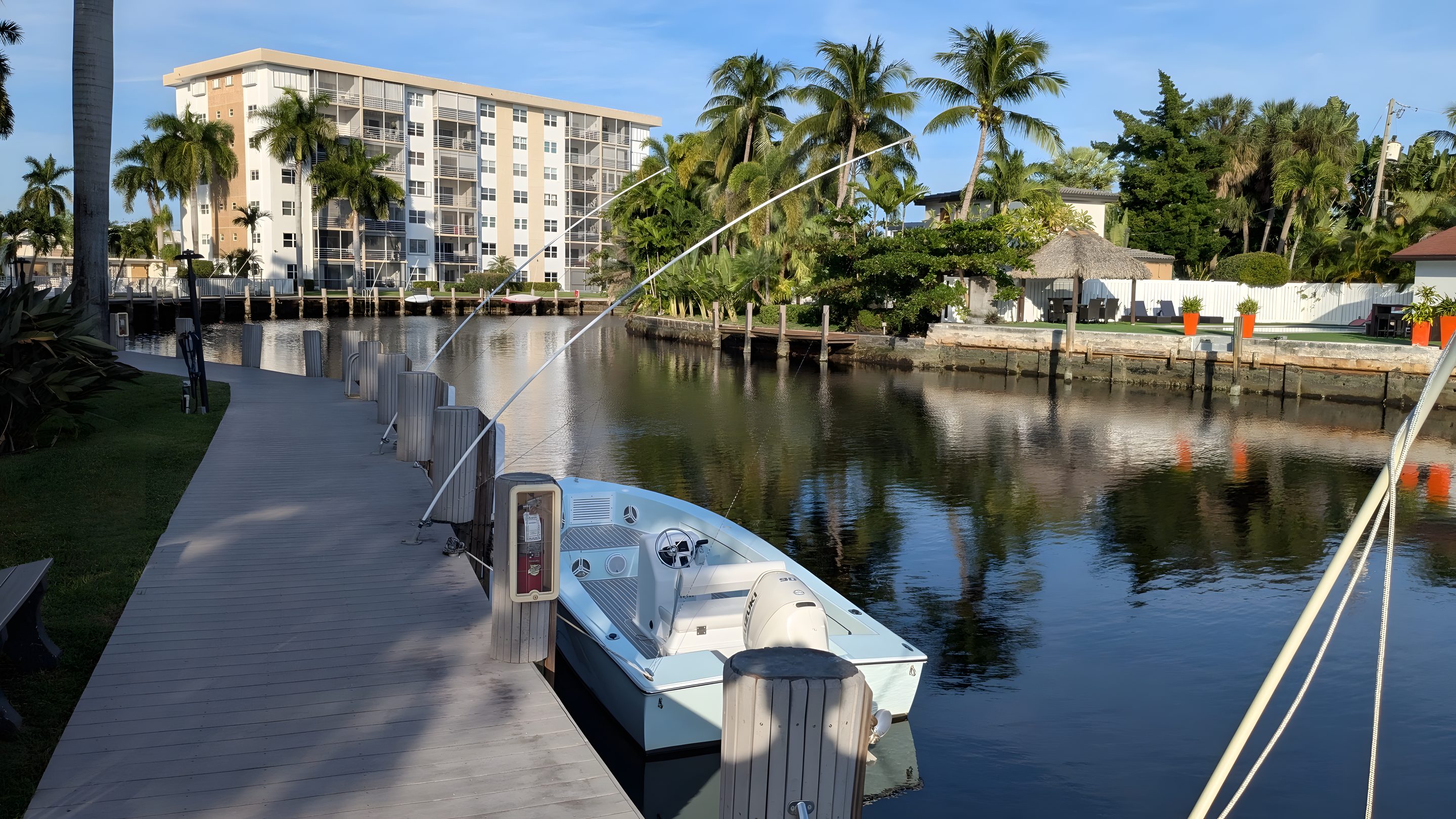A boat moored along the boardwalk on the Middle River at River Terrace.