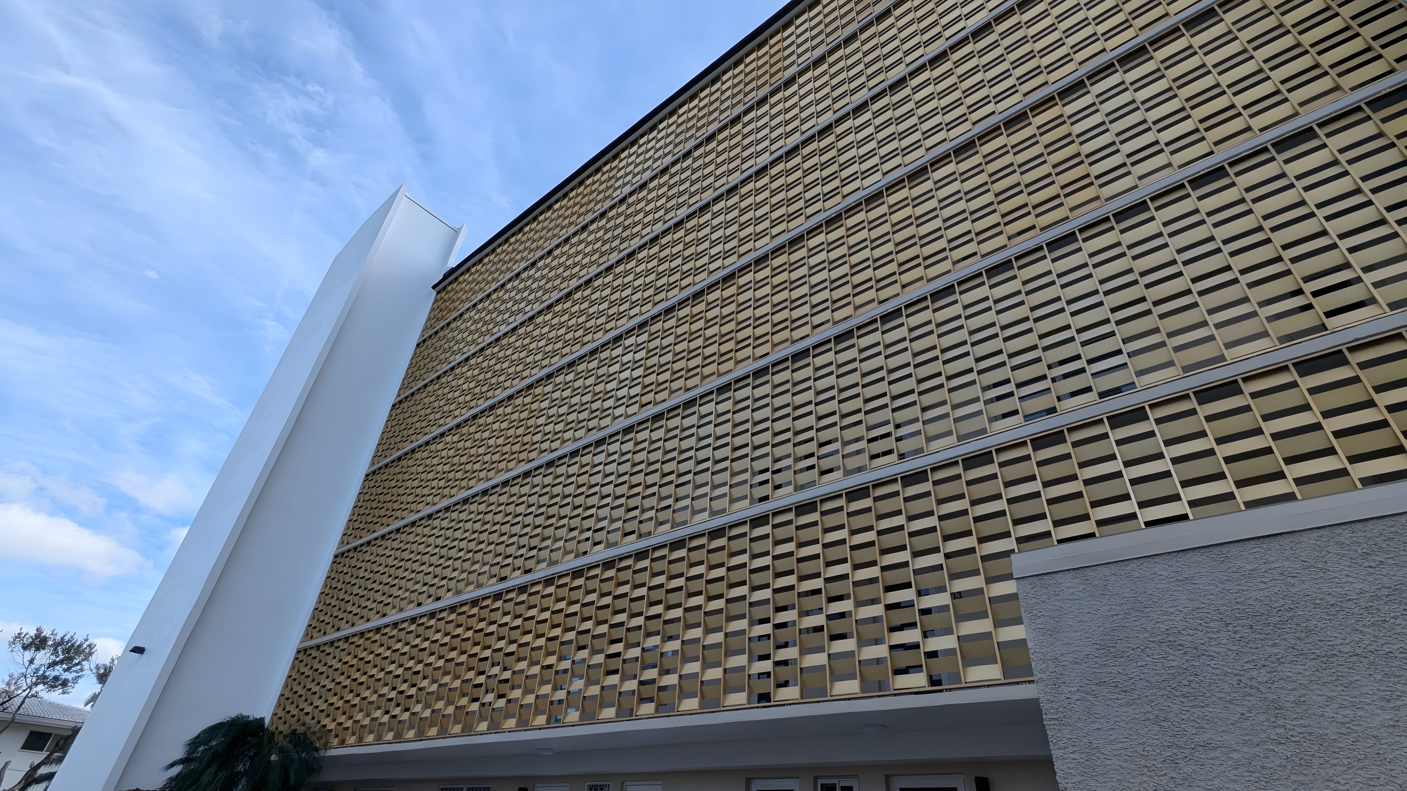 The gold anodised screen wall on the facade of River Terrace.